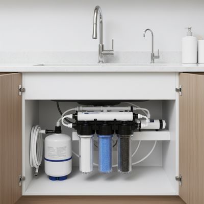 Under-sink reverse osmosis water filter system installed under a kitchen sink